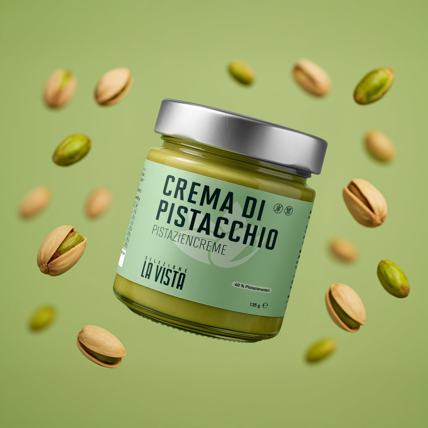 Glas Pistaziencreme mit Löffel – cremige grüne Textur